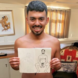 Marlon Lorenty holding drawing of life drawing model for 365 Naturists