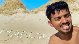Marlon written on the sand and selfie